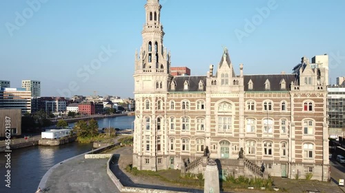 
Drone zoom out shot of Loodswezen in Antwerp, revealing the MAS museum and flying over the river Scheldt photo