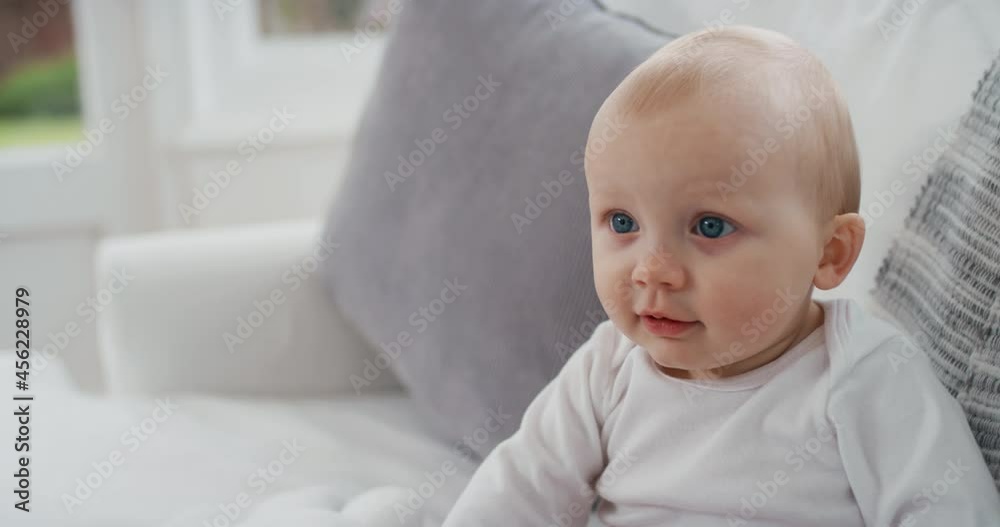 portrait happy baby with beautiful blue eyes looking curious toddler smiling enjoying life healthy little infant at home 4k portrait happy baby with beautiful blue eyes looking curious toddler smiling enjoying life healthy little infant at home 4k