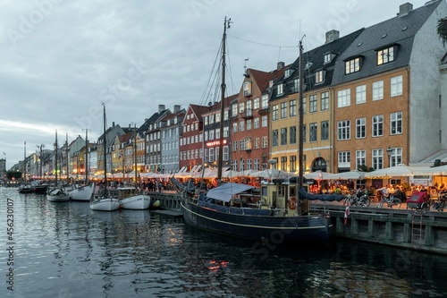 Copenhague, Denmark. September 28, 2019: Nyhavn promenade with colorful architecture and boats on the canal. © camaralucida1