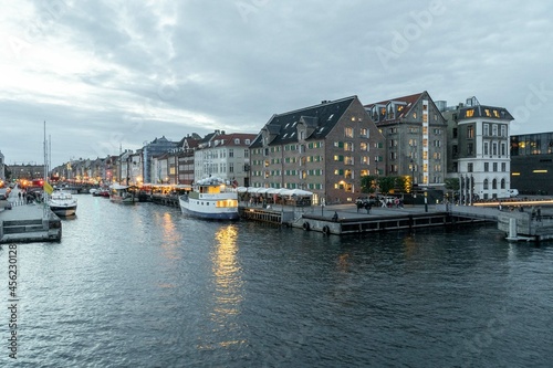 Copenhague  Denmark. September 28  2019  Nyhavn promenade with colorful architecture and boats on the canal.