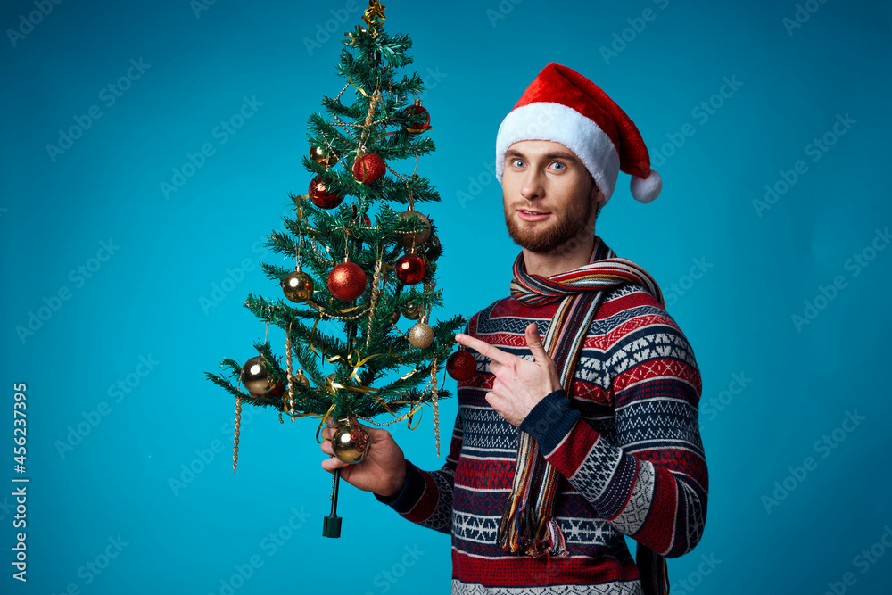 Cheerful man in a christmas white mockup poster studio posing Cheerful man in a christmas white mockup poster studio posing