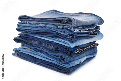 Denim jeans isolated at white background. Stack of jean