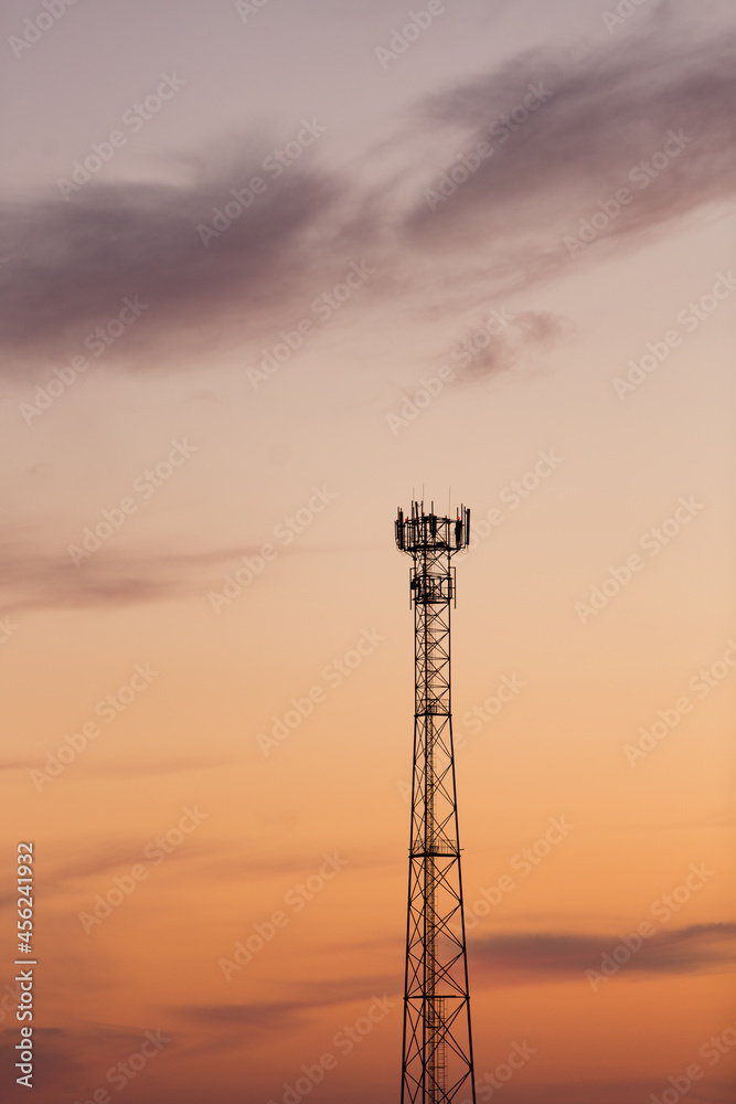 mobile operator tower at dawn