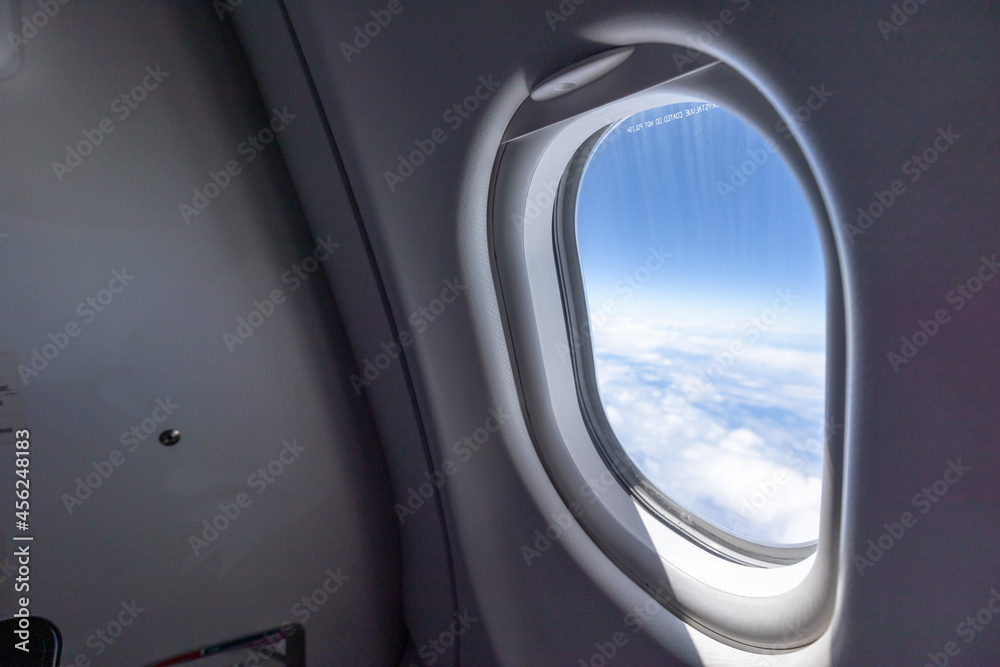 Airplane window cloud and blue sky