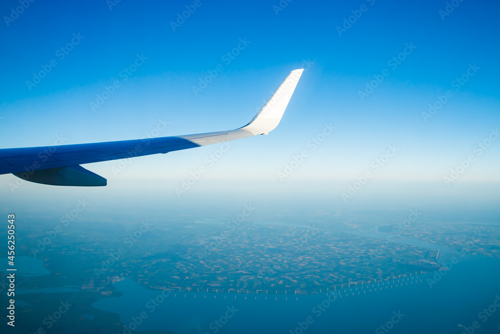 Amsterdam, Netherlands - 17 July 2021: KLM Plain wing over Holland. Flight from Amsterdam to Helsinki.
