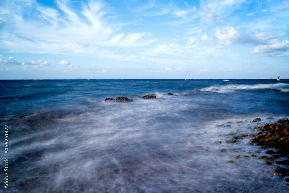sea landscape with long exposure with cloudy sky