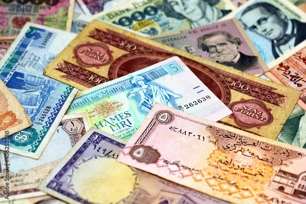 Colorful old World Paper Money background, Banknotes of different countries  collection, international banknotes for global currencies concept for money  exchange business, vintage retro ancient money Photos | Adobe Stock