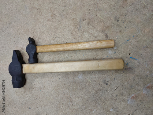 Fotografia, Obraz two hammers with wooden handles on the workbench