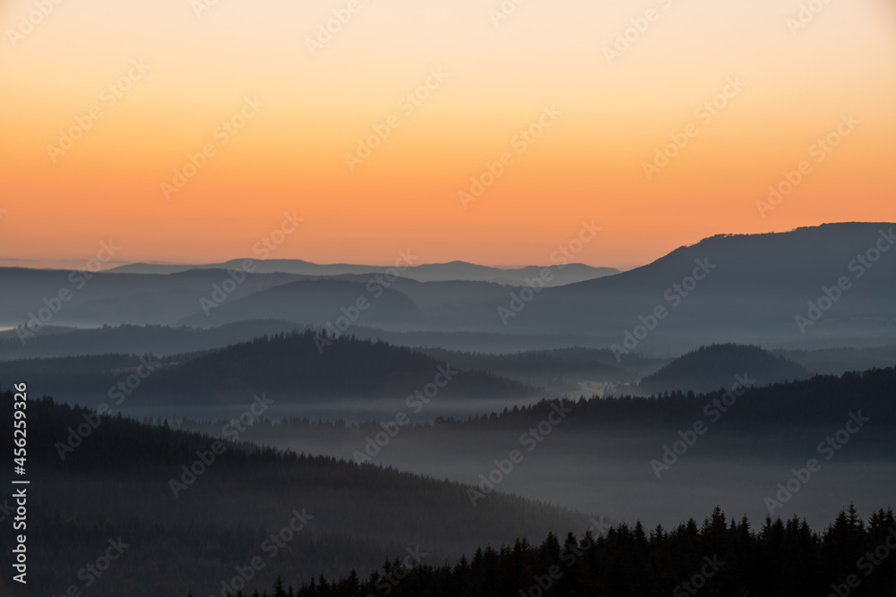 a beautiful landscape with hills and valleys in the morning