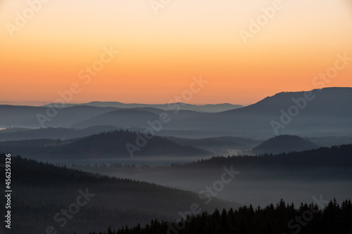 a beautiful landscape with hills and valleys in the morning