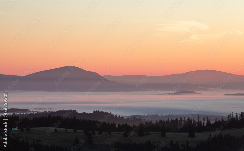 morning landscape with mountains and fog in the valleys