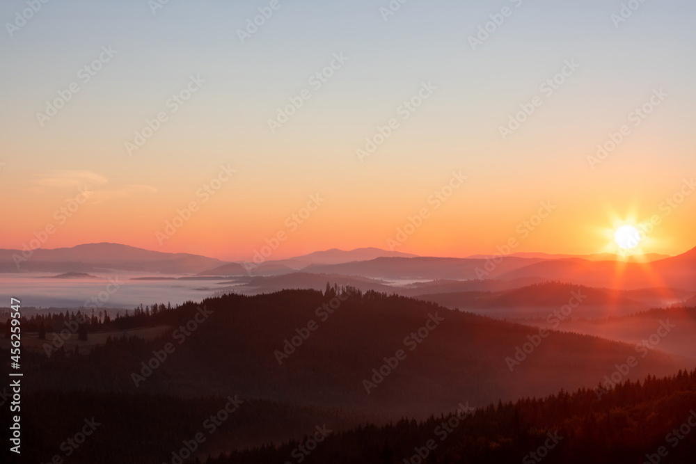 A beautiful landscape with sunrise over the mountains