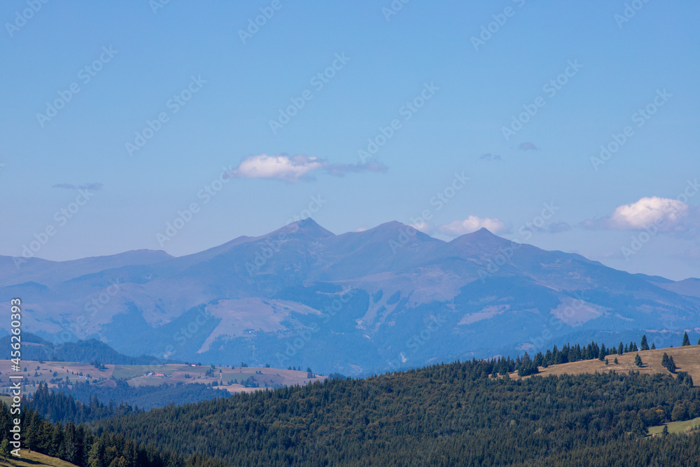 Fototapeta premium Ineu peak in the Rodnei mountains seen through the fog