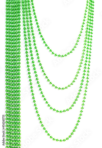Green Christmas bead garland hanging on white background