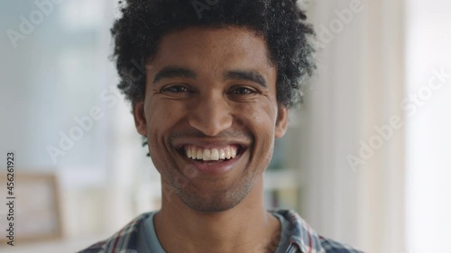 portrait happy mixed race man smiling enjoying successful lifestyle healthy man at home looking confident