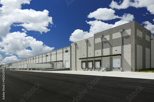 Modern gray and white industrial warehouse distribution building photo