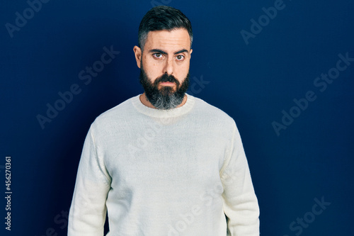 Young hispanic man wearing casual clothes depressed and worry for distress, crying angry and afraid. sad expression.
