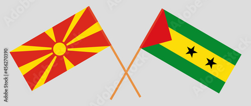 Crossed flags of North Macedonia and Sao Tome and Principe. Official colors. Correct proportion