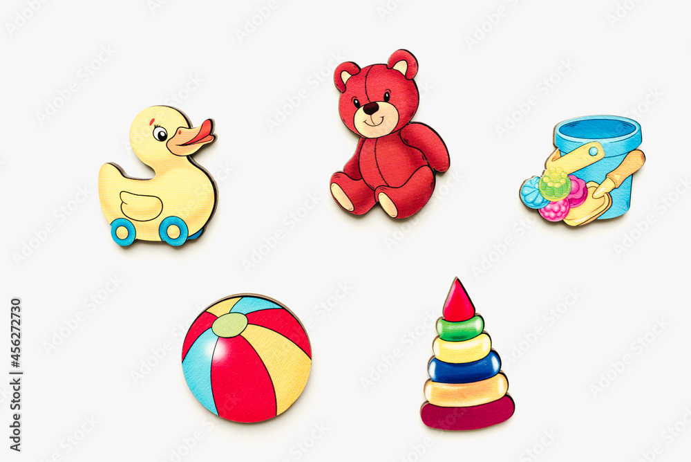 Fototapeta premium Educational toys on a white background. Wooden toys on a white background. Bright pictures. Wooden pictures. 