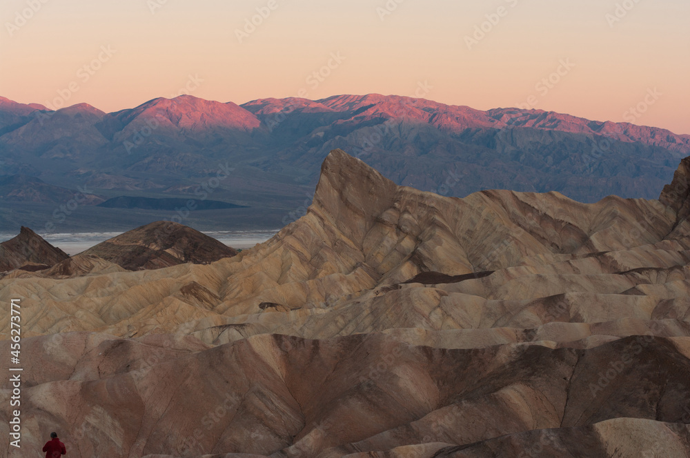Death Valley National Park showing Manly Beacon at Zabriskie Point in the foreground with beautiful dawn light.