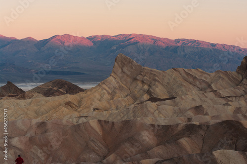 Death Valley National Park showing Manly Beacon at Zabriskie Point in the foreground with beautiful dawn light.