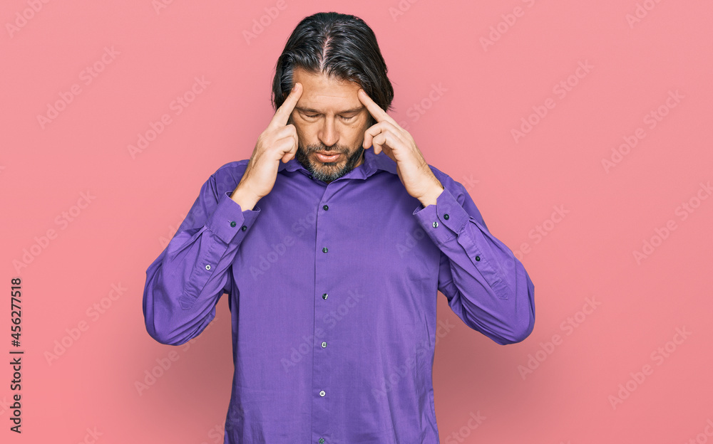 Middle age handsome man wearing business shirt with hand on head for pain in head because stress. suffering migraine. Middle age handsome man wearing business shirt with hand on head for pain in head because stress. suffering migraine.