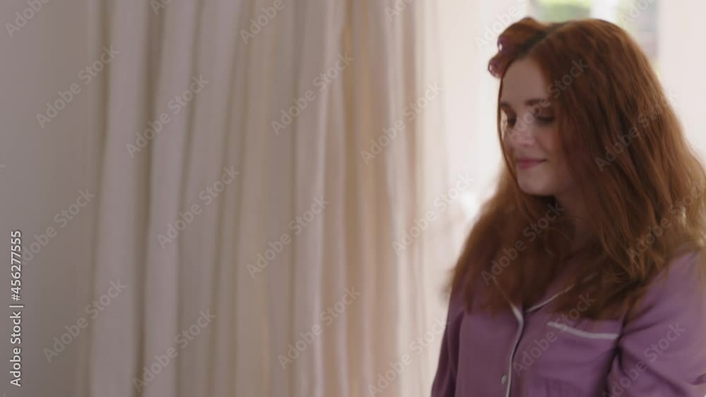 happy woman dancing in bedroom enjoying weekend morning having fun celebrating carefree lifestyle wearing pajamas at home happy woman dancing in bedroom enjoying weekend morning having fun celebrating carefree lifestyle wearing pajamas at home
