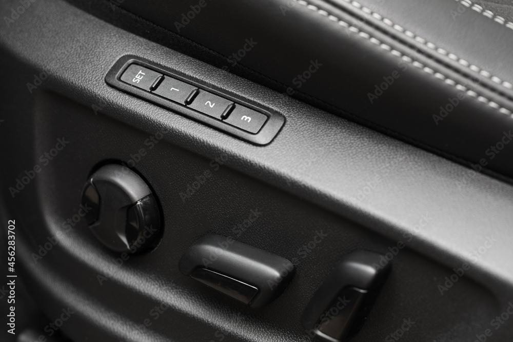 Close-up of height and position adjustment panel for driver's leather seat - Image Close-up of height and position adjustment panel for driver's leather seat - Image