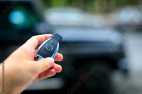 hand with car key less go - Image