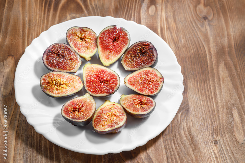 A slice of delicious figs on a plate. Top view. A slice of delicious figs on a plate. Top view.