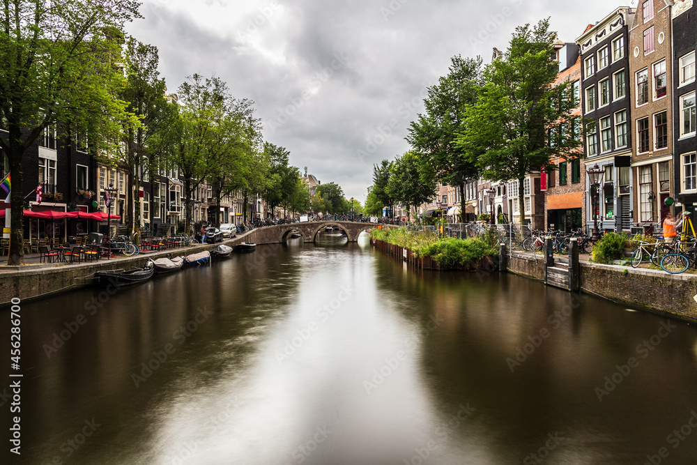 Water canal in Amsterdam, capital and most populous city of the Netherlands. Long exposure photography