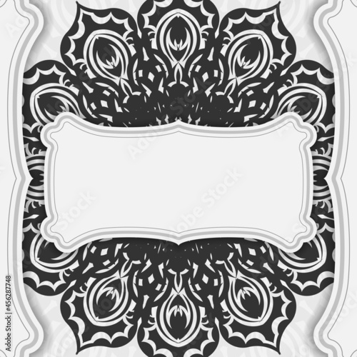 Vector white color postcard design with black mandala ornament. Invitation card design with space for your text and patterns. © Javvani