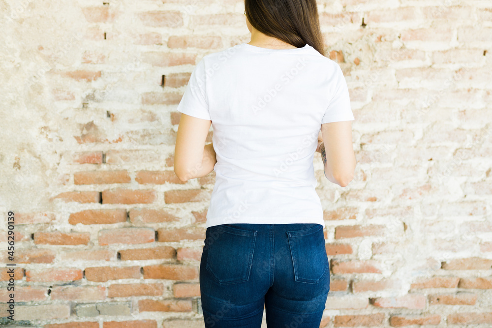 Rear view of a woman with a custom print t-shirt