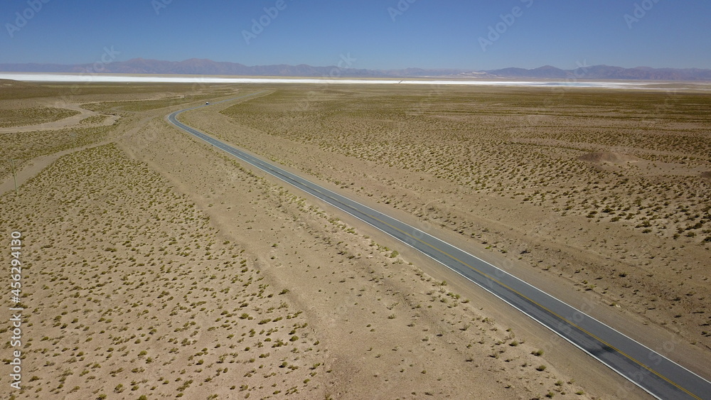 Naklejka premium route in desert on high plain shot with drone