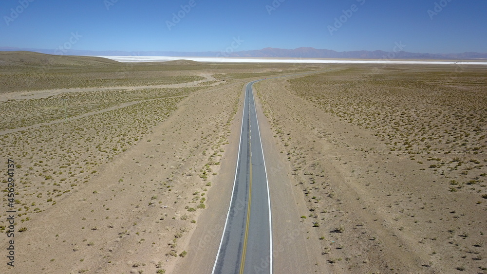 Naklejka premium route in desert on high plain shot with drone