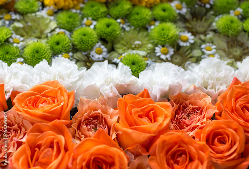 Composition of orange  white and green flowers