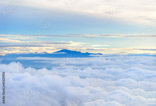 A morning landscape mountains with dramatic sky and fog