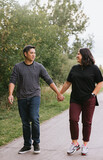 Couple walking outdoors in park