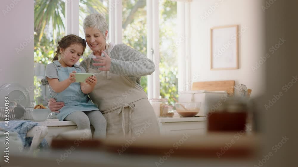 grandmother and child using smartphone having video chat little girl sharing vacation weekend with granny enjoying chatting on mobile phone at home with granddaughter grandmother and child using smartphone having video chat little girl sharing vacation weekend with granny enjoying chatting on mobile phone at home with granddaughter