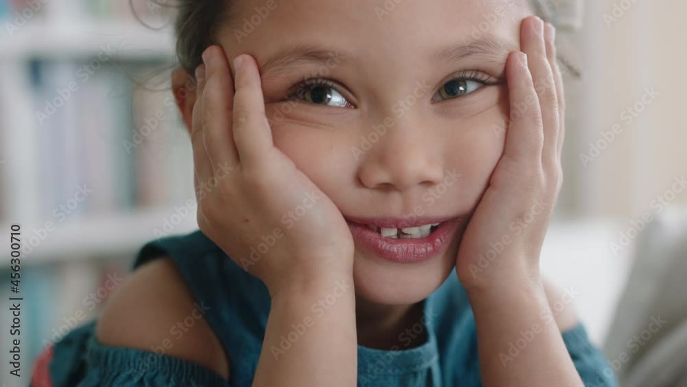 portrait happy little girl smiling with natural childhood curiosity looking joyful child with innocent playful expression 4k footage portrait happy little girl smiling with natural childhood curiosity looking joyful child with innocent playful expression 4k footage