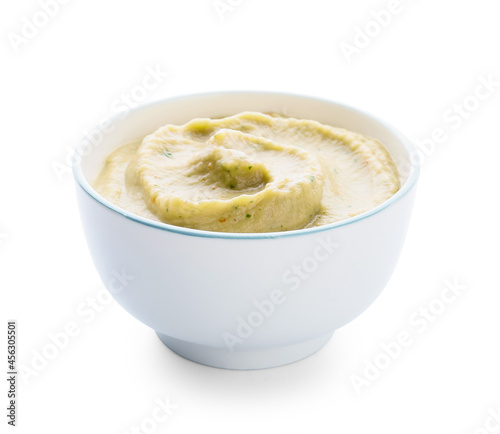 Bowl with delicious baba ghanoush on white background