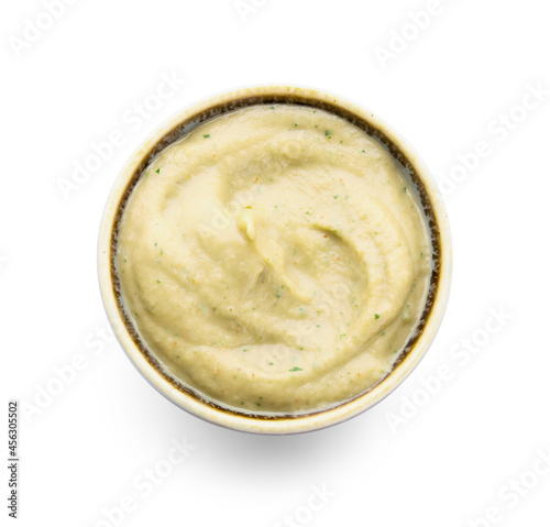 Bowl with tasty baba ghanoush on white background, top view