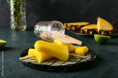 Plate with tasty pineapple ...