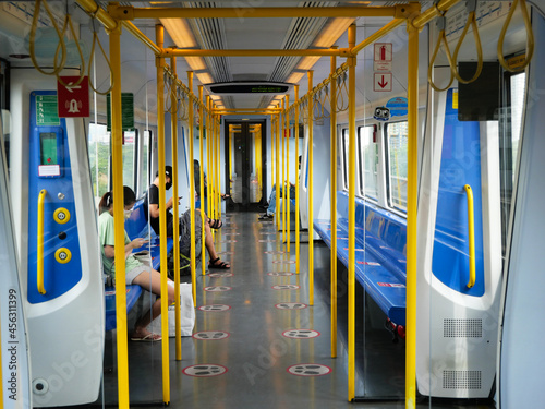 The doors in the trains are closing. while the electric train is running at high speed