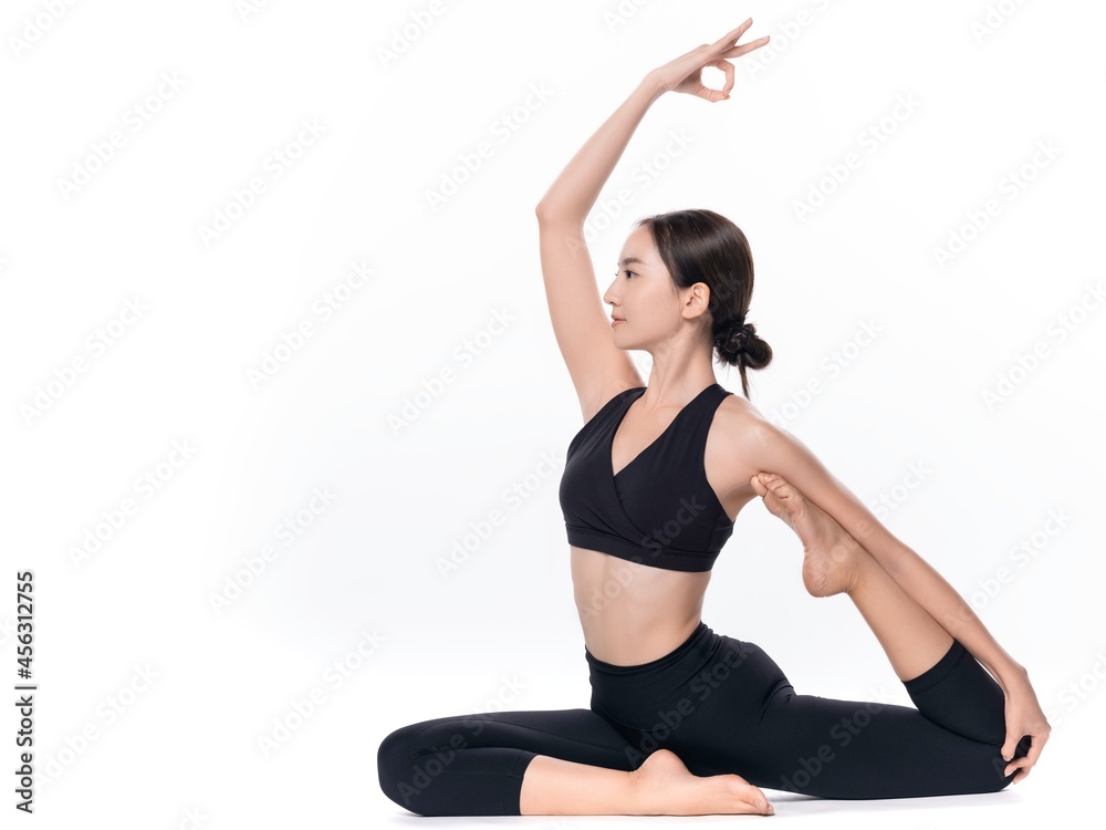 Beautiful sporty woman doing advanced yoga practice on white bac Beautiful sporty woman doing advanced yoga practice on white bac