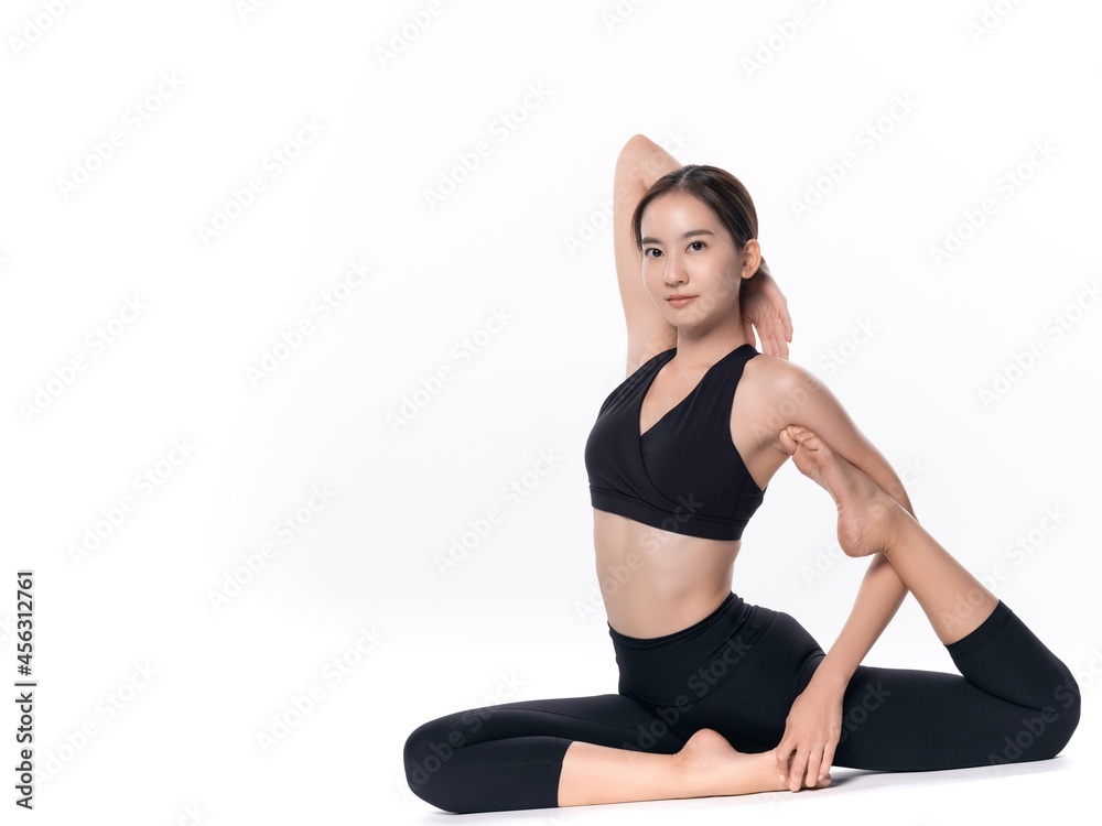 Beautiful sporty woman doing advanced yoga practice on white bac Beautiful sporty woman doing advanced yoga practice on white bac