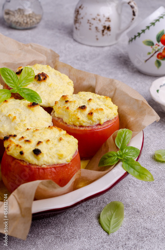 Stewed tomatoes stuffed with cheese