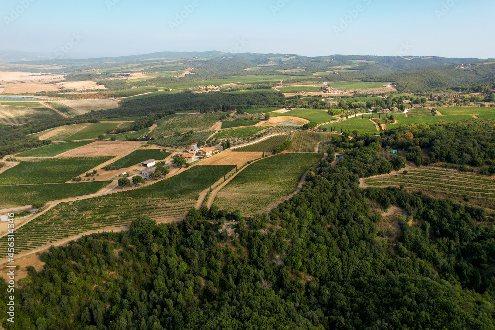 Landscape in Tuscany photographed with a drone. Fields, valley of Toscana, Siena region in Italy with roads, fields, forests and grape farms. Province of Siena Italy Landscape in Tuscany photographed with a drone. Fields, valley of Toscana, Siena region in Italy with roads, fields, forests and grape farms. Province of Siena Italy