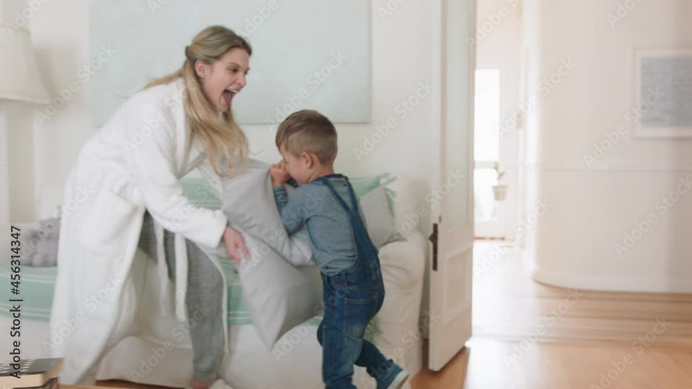 happy mother and son play catch running through house mom playing game having pillow fight with little boy enjoying fun weekend together 4k footage happy mother and son play catch running through house mom playing game having pillow fight with little boy enjoying fun weekend together 4k footage