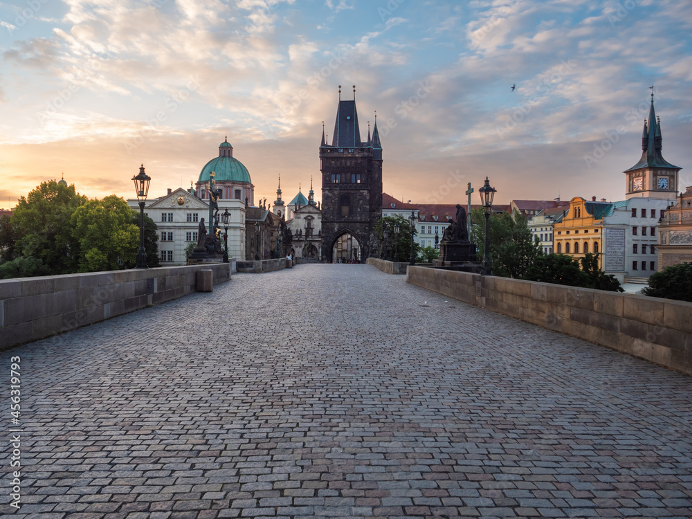 Naklejka premium Charles Bridge or Karluv Most in Prague Empty at Sunrise on a Summer Morning